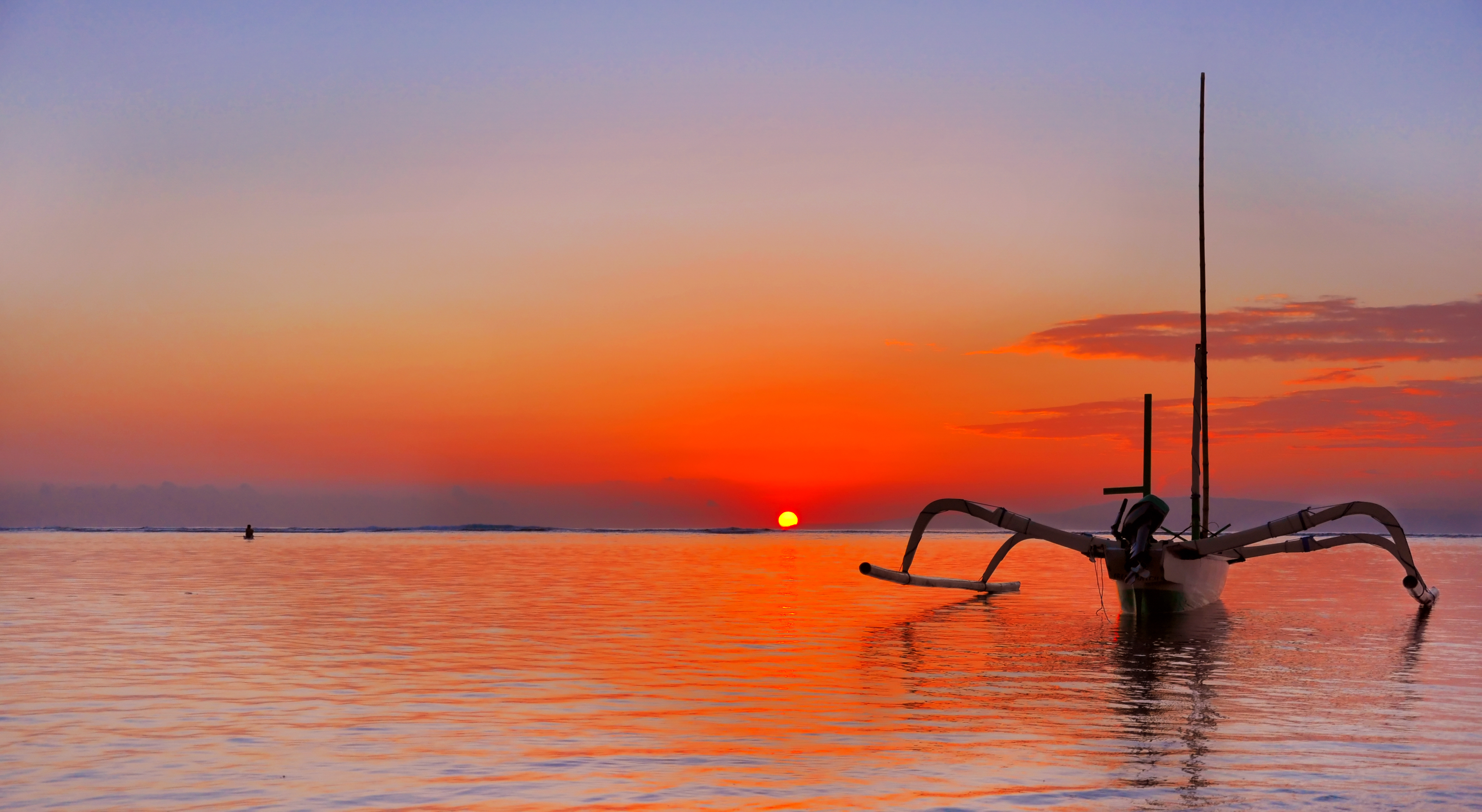Beautiful sunset in Bali with Jukung Boat