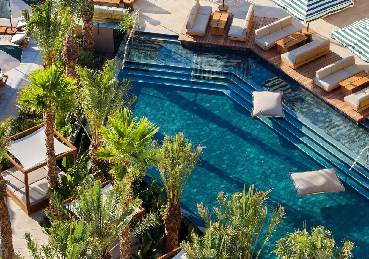 Outdoor pool area at Daios Cove Luxury Hotel in Crete.