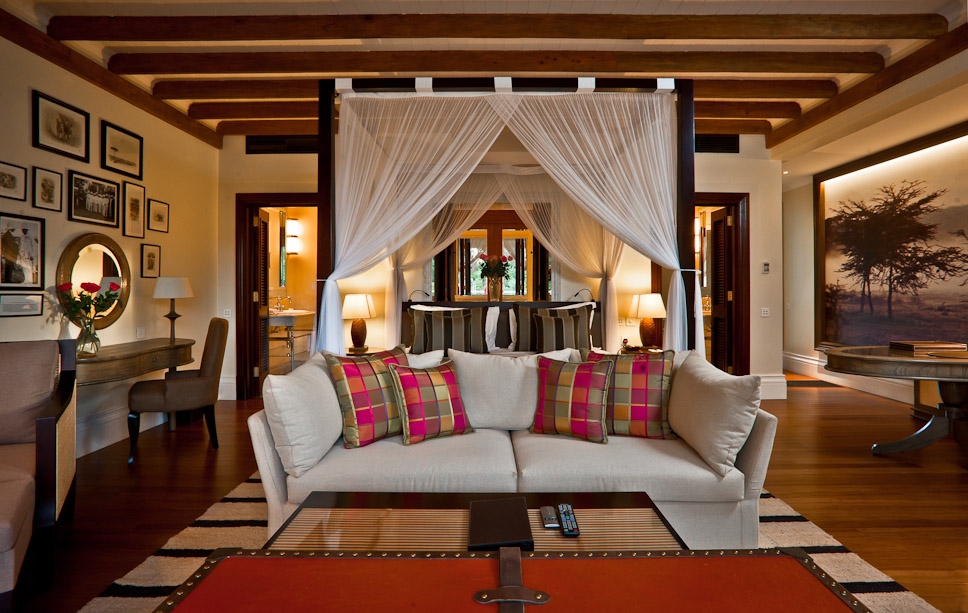 Suite with bed and sofa at Hemingways Naibobi