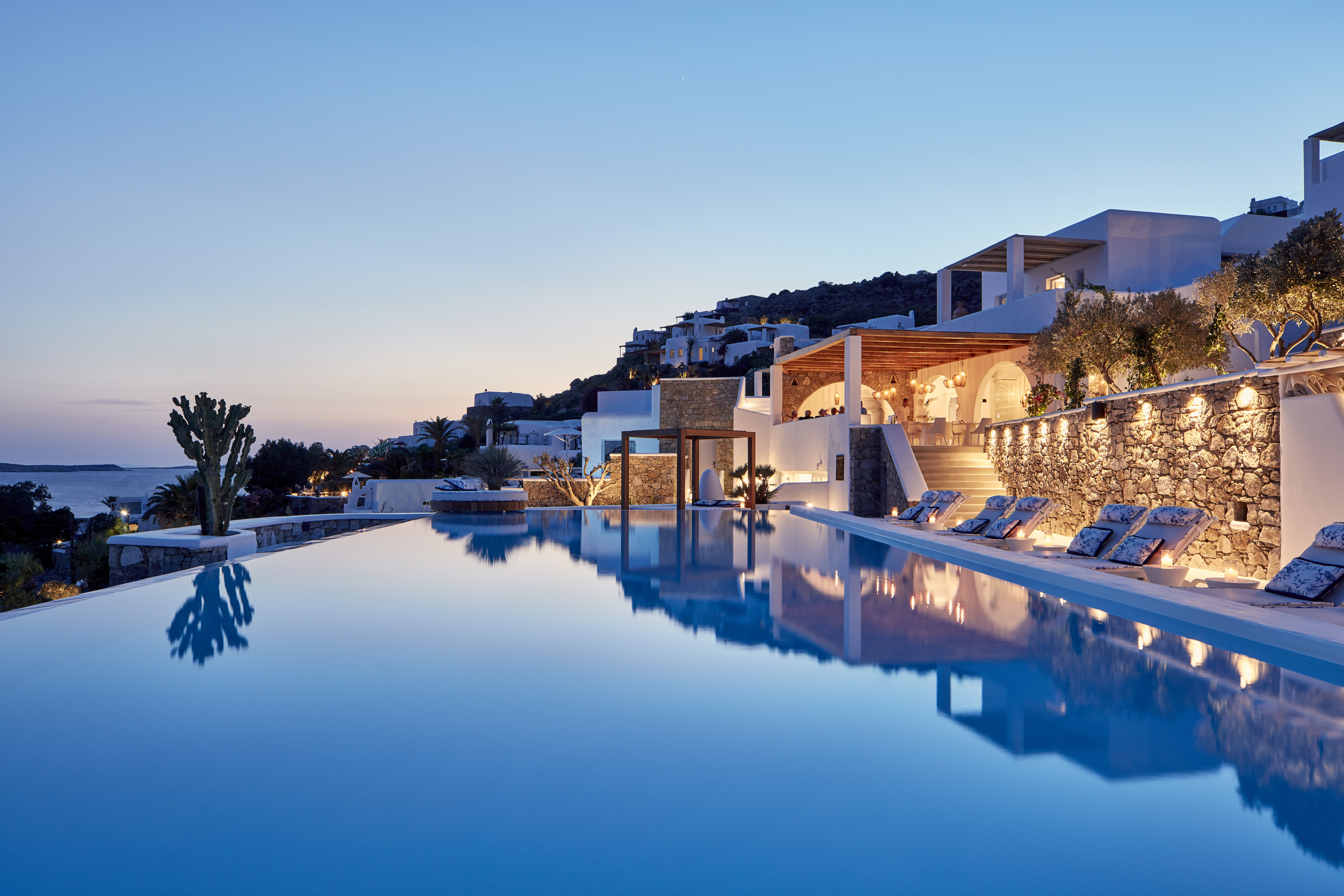 pool lights and sun setting at Katikies Mykonos