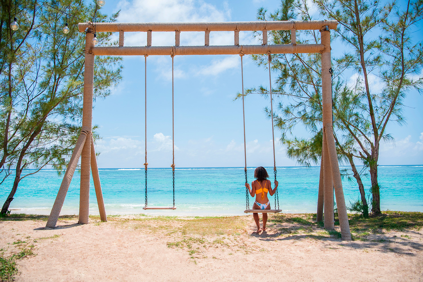 lady on the swing at C Mauritius