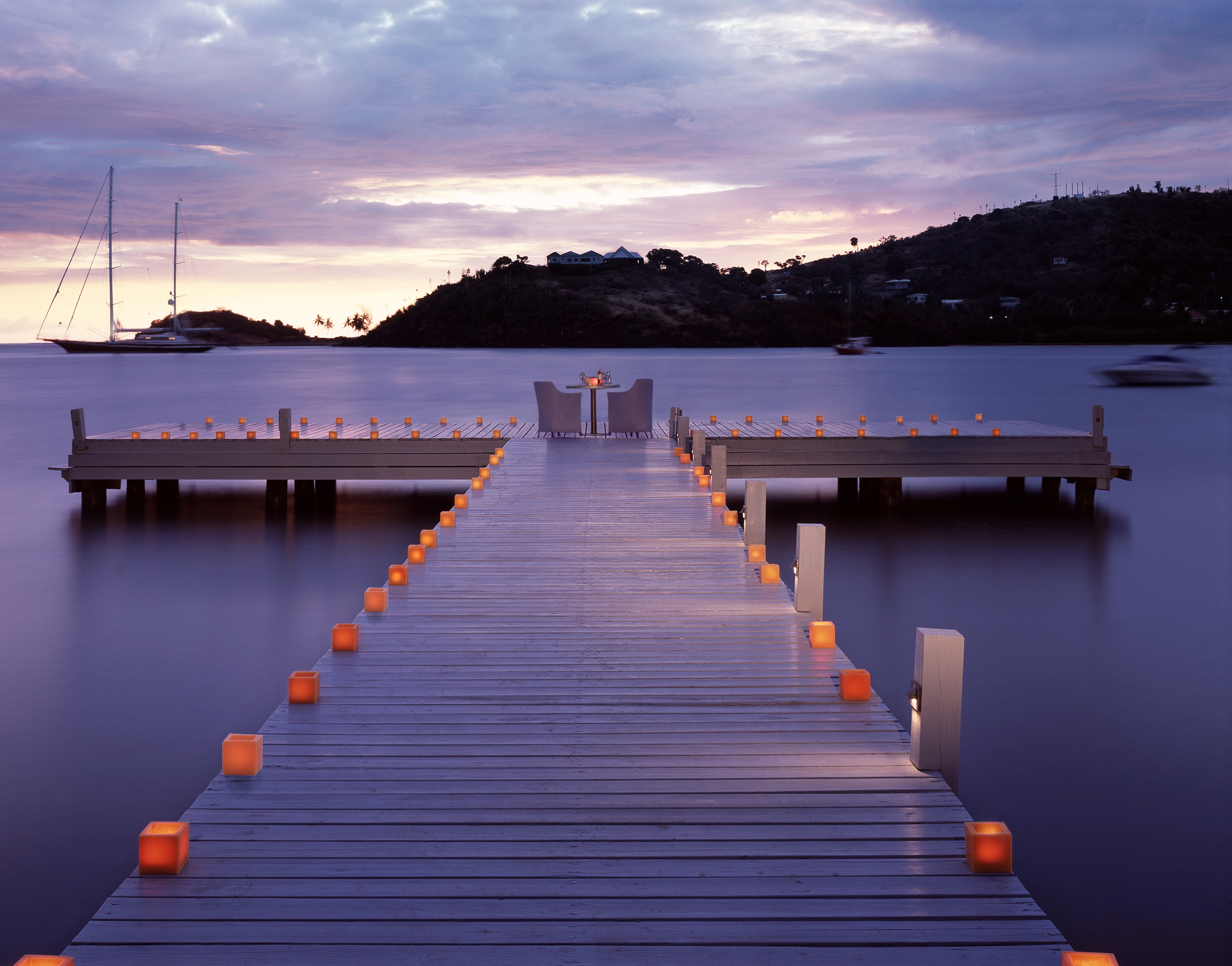 Romantic jetty dinner at Carlisle Bay overlooking tranquil water
