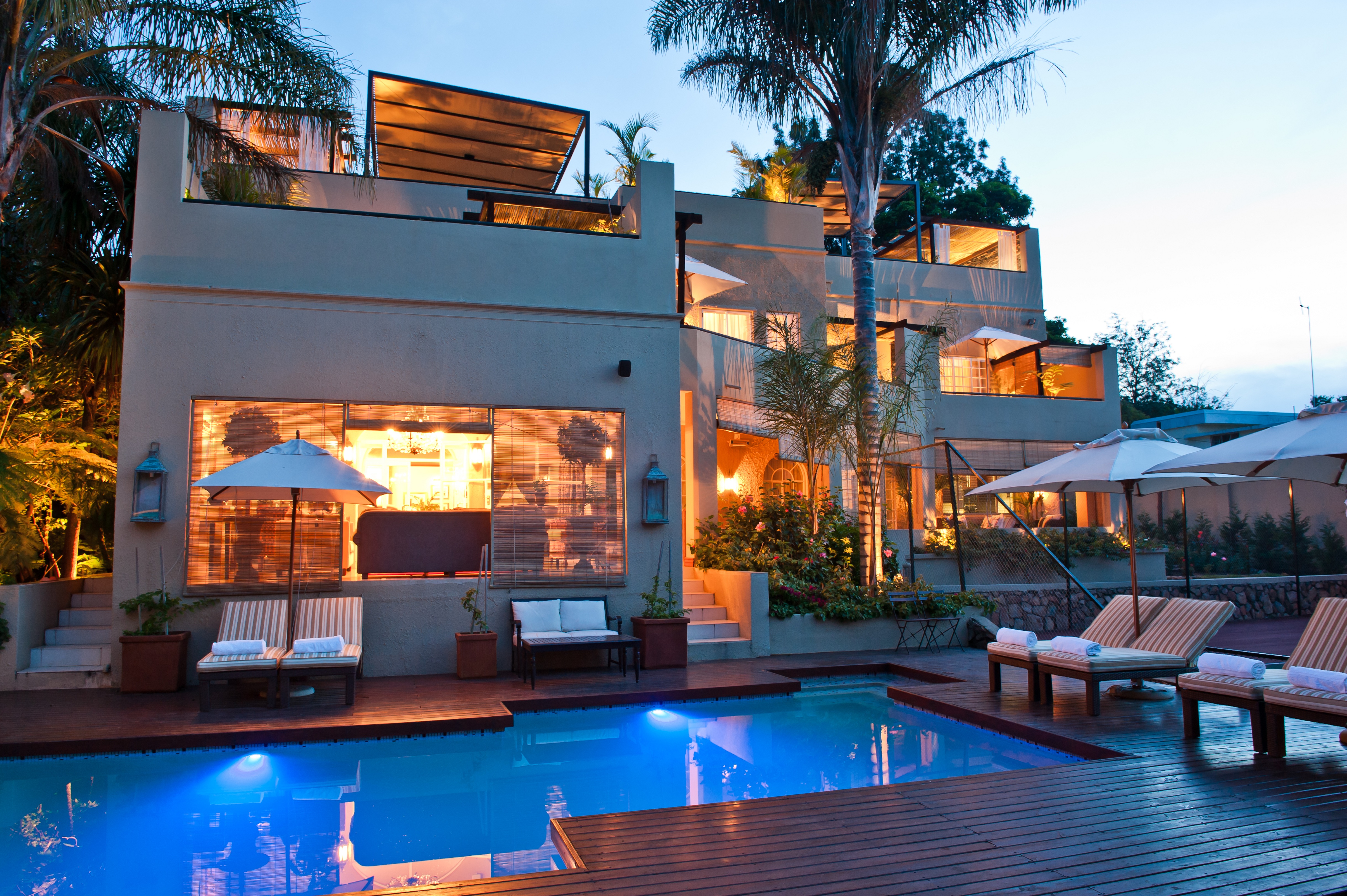 Swimming pool an exterior at dusk at The Residence Johannesburg
