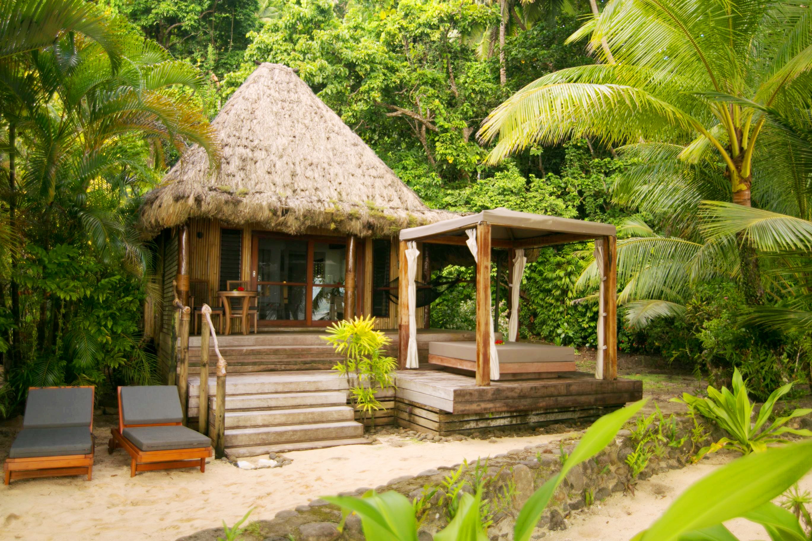 Qamea Resort & Spa Honeymoon Bure from outside with bed cabana