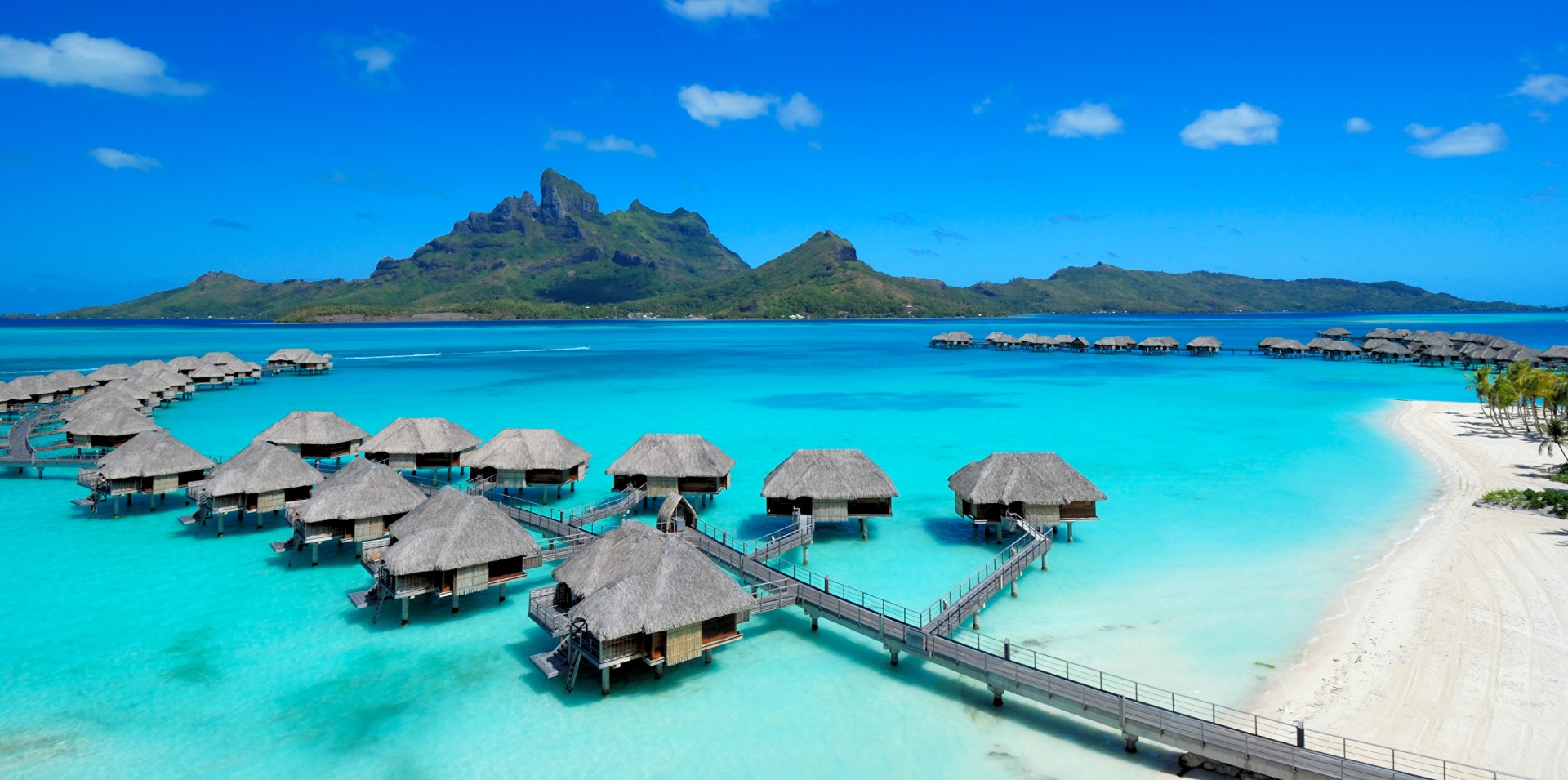 Four Seasons Resort Bora Bora over water Bungalows with Mount Otemanu in the background