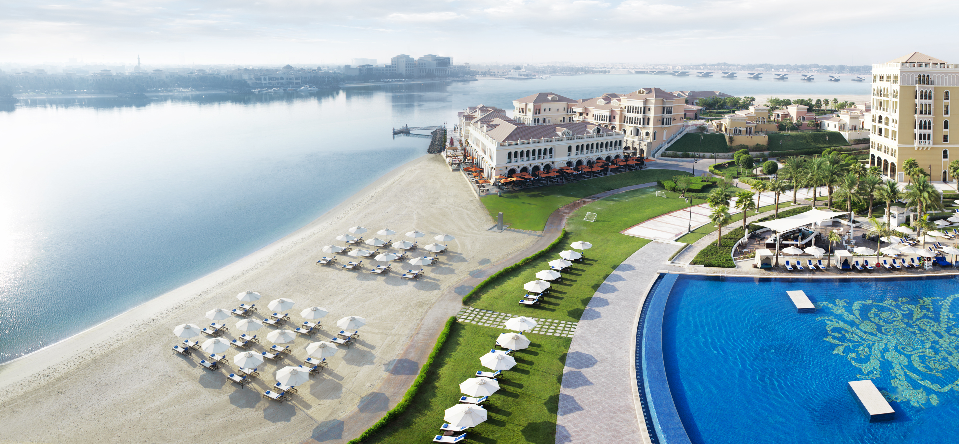 The various blues of the sea and the pool vie for visual supremacy, narrowly separated by the golden sand of the beach at the Ritz Carlton, Abu Dhabi