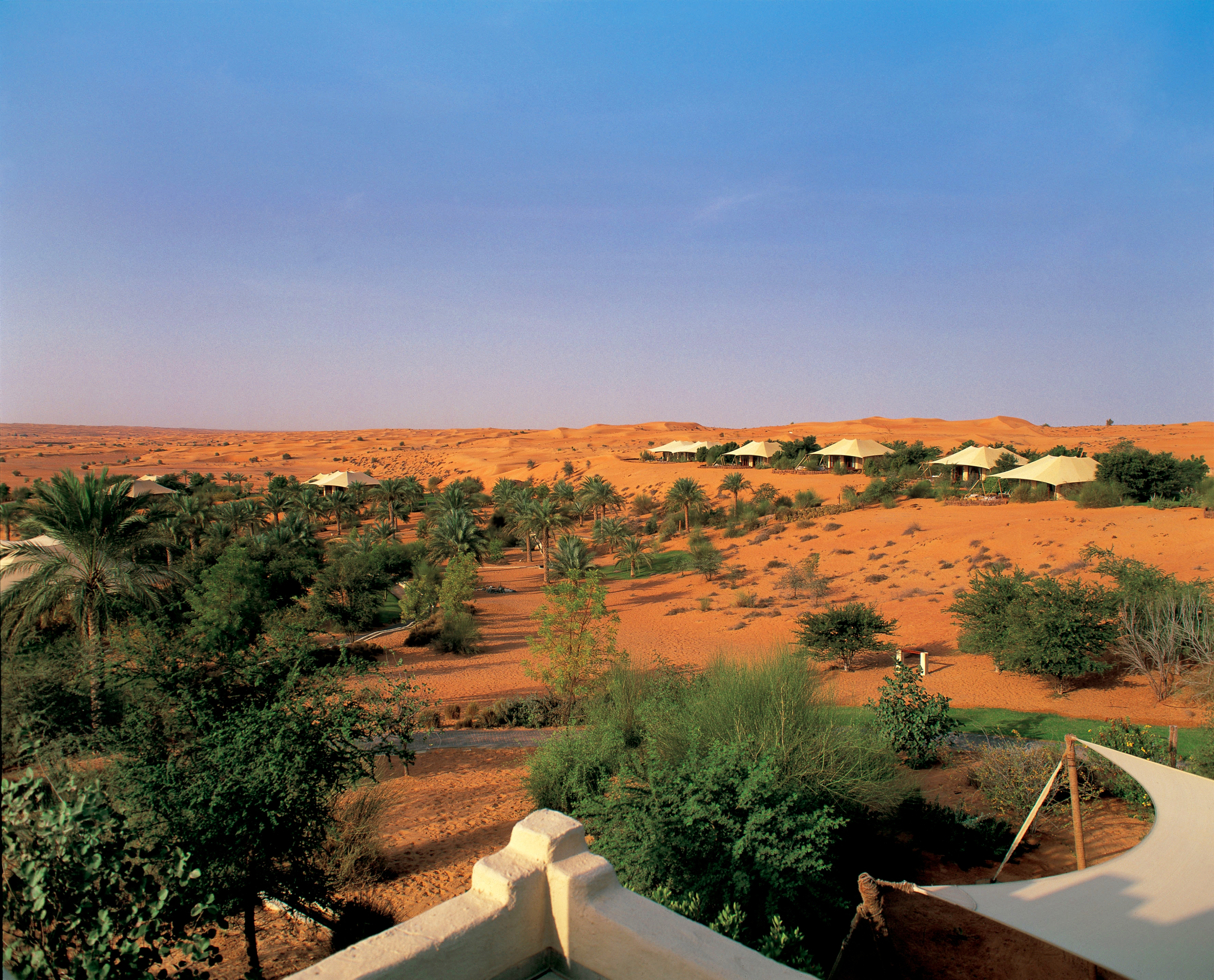 Various bedouin suites stand out against the rugged landscape at the Al-Maha Desert Resort and Spa, Dubai