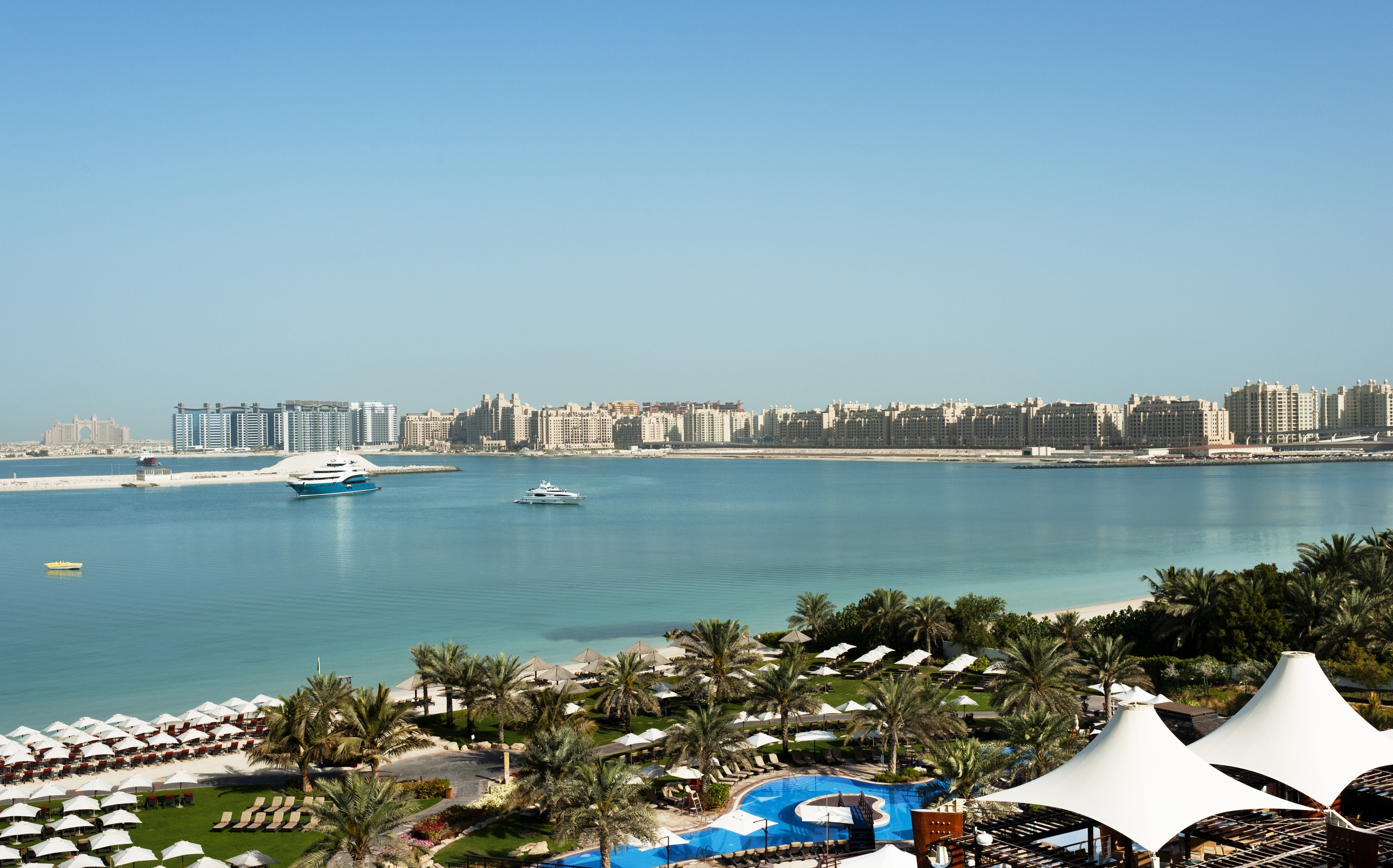 The view over the clear, calm waters to Dubai city from Westin Mina Seyahi Beach Resort, Dubai