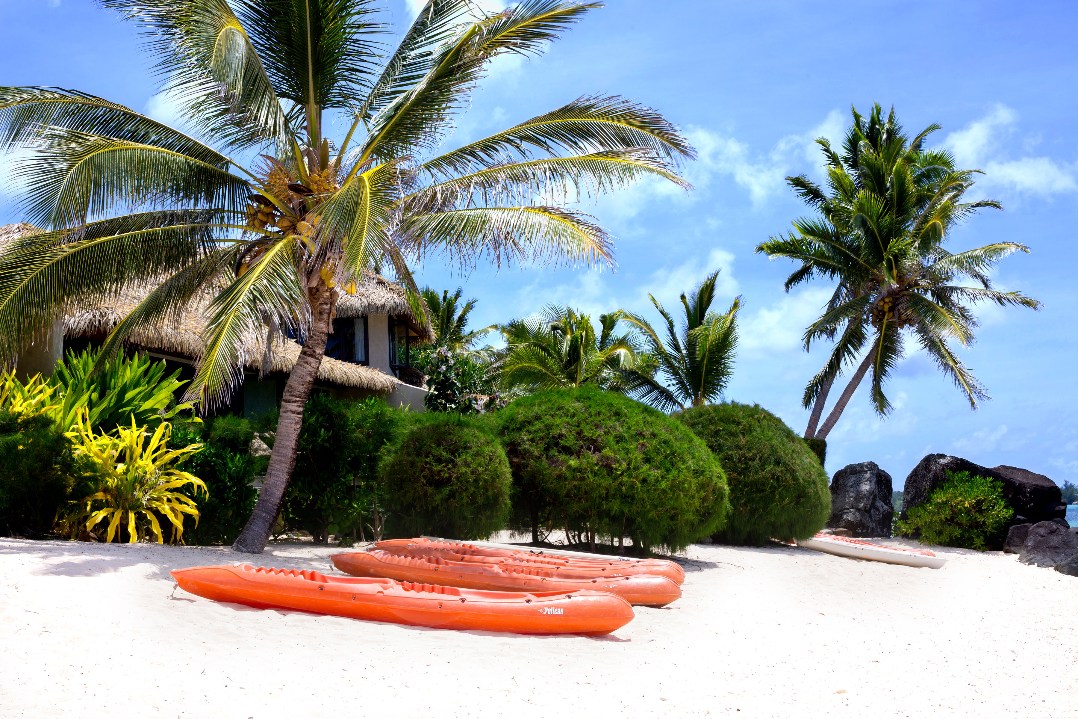 Kayaks on the beach at Te Manava Luxury Villas & Spa