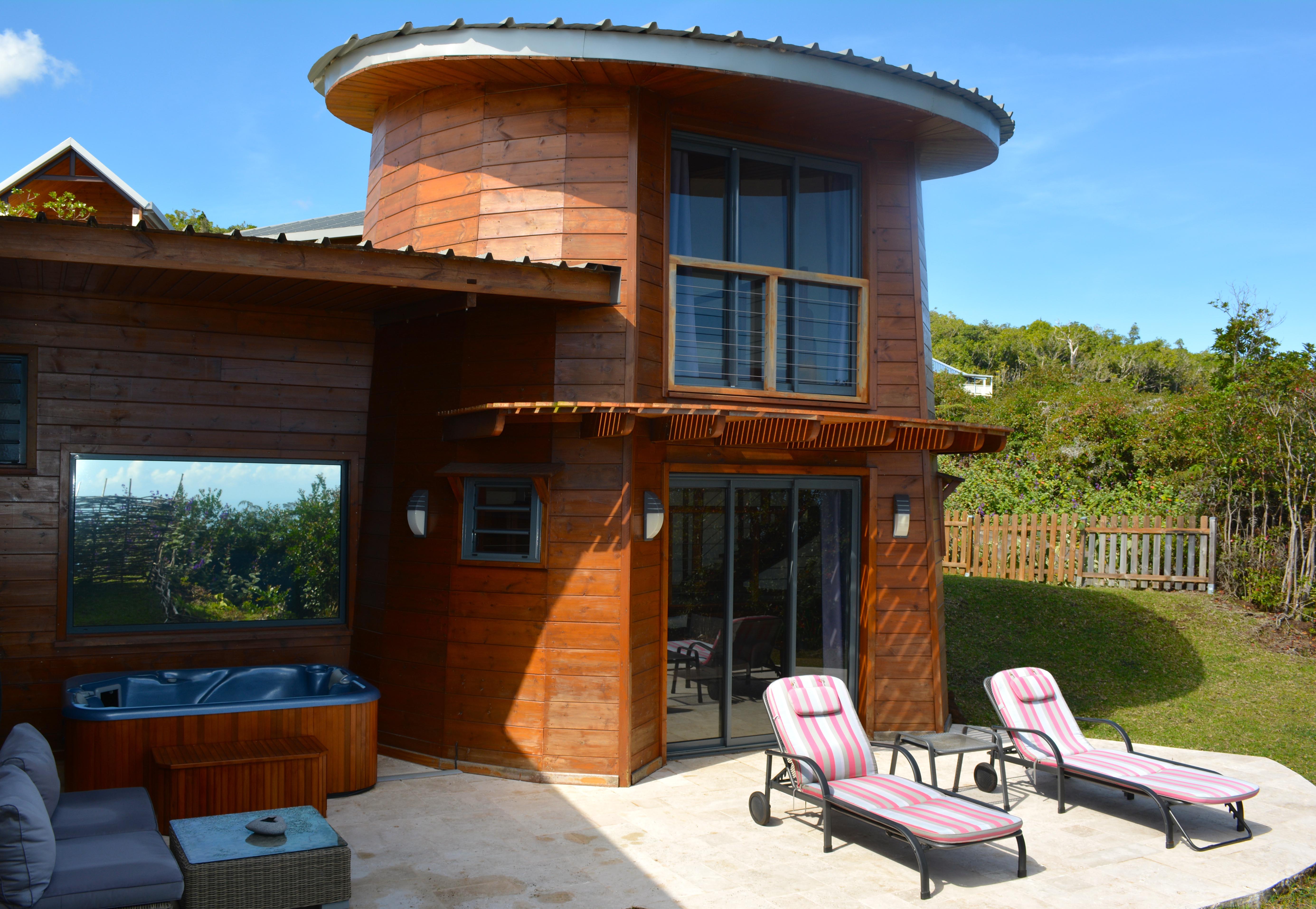 The naturally-inspired design of a Suite looks stunning, with some basking sun loungers at Diana Dea Lodge, Reunion Island