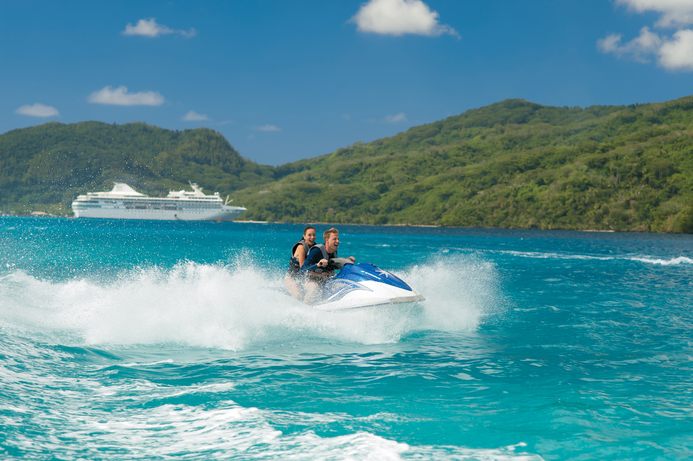 Jet ski in front of Paul Gauguin cruise
