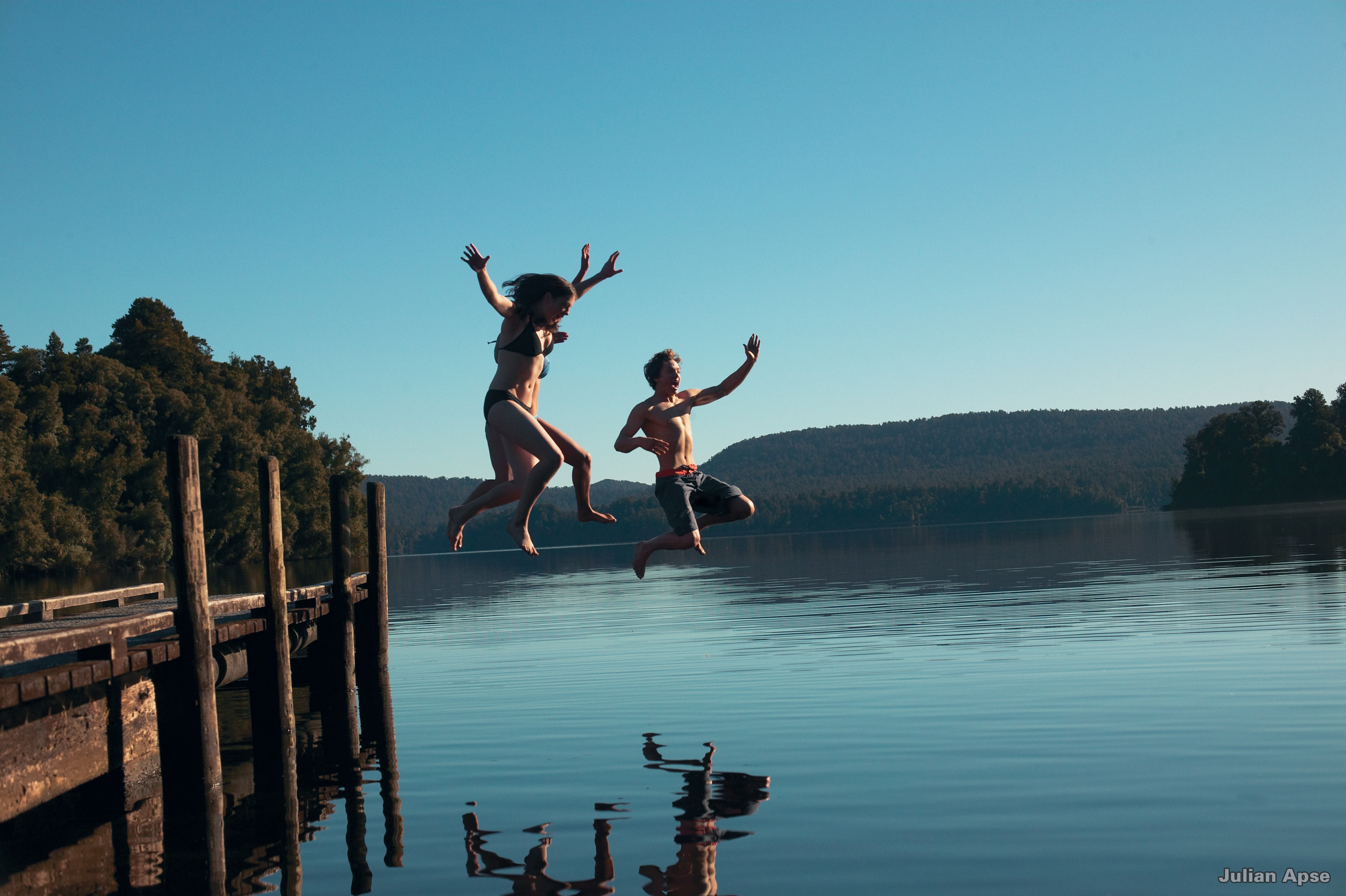 Kids jumping in lake